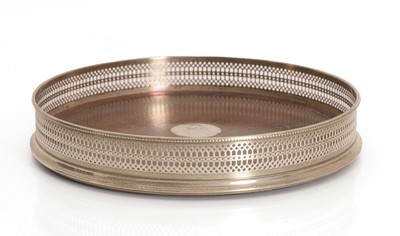 Lot 16 - A large silver collared coaster