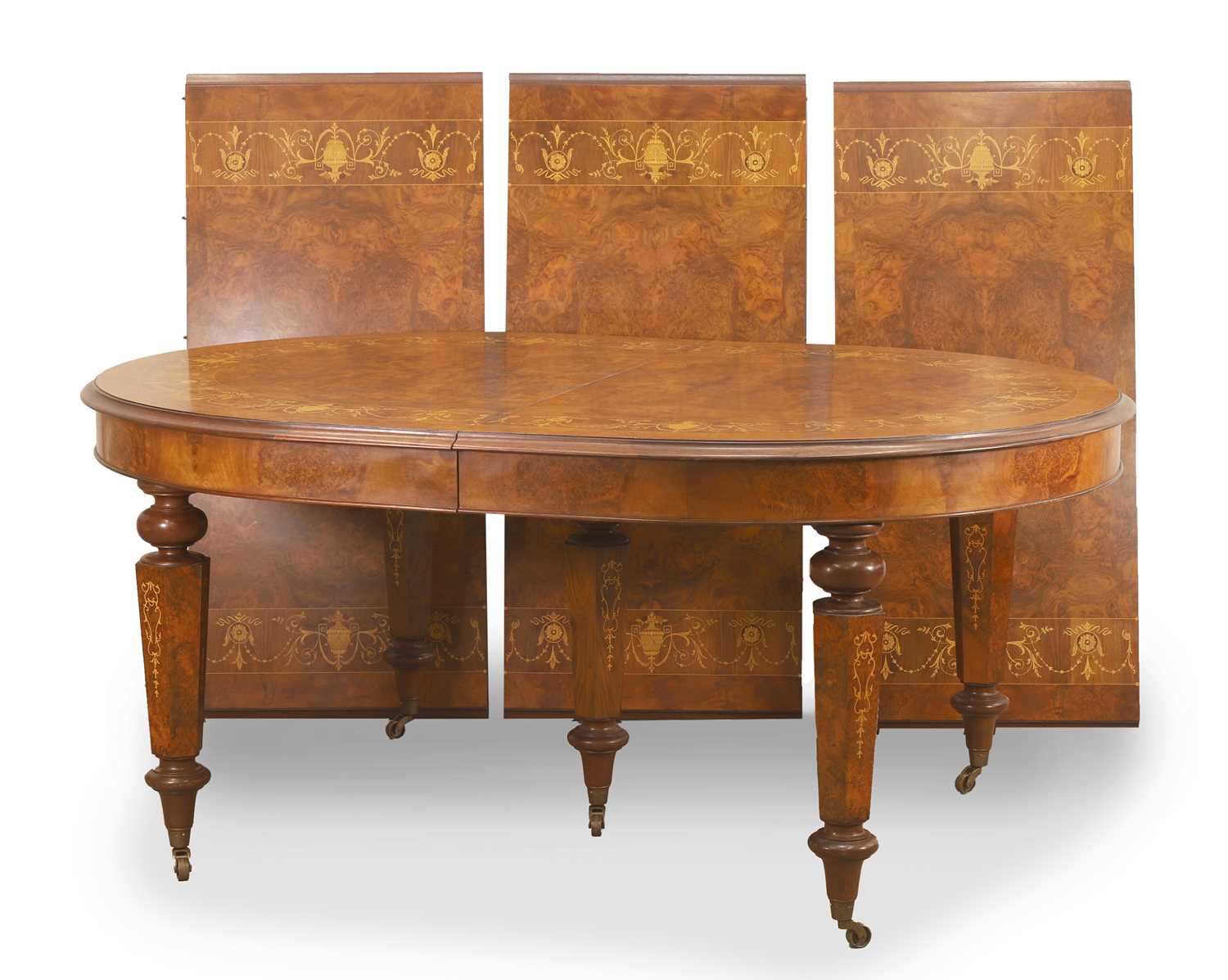 Lot 521 - An inlaid walnut extending dining table
