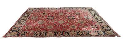 Lot 430 - A large pink ground carpet