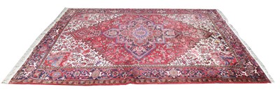 Lot 429 - A Large Heriz Rug