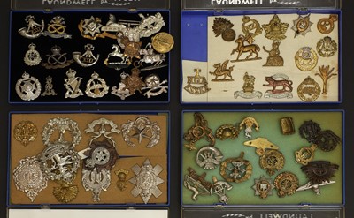 Lot 311 - A collection of military cap badges and regimental insignia
