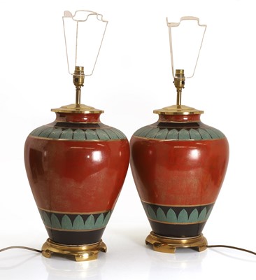 Lot 476 - A pair of large Egyptian revival pottery table lamps