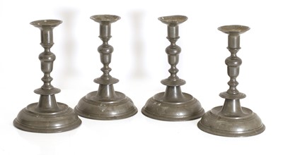Lot 301 - A set of four pewter candlesticks