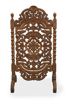 Lot 536 - A pierced walnut fire screen