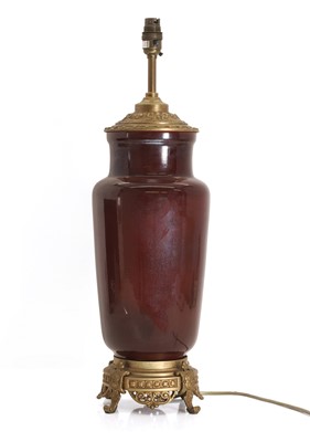 Lot 473 - A large sang de boeuf table lamp