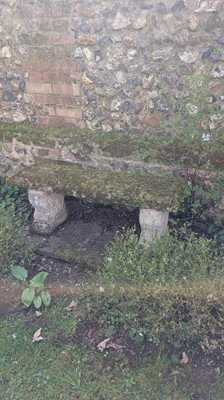 Lot 560 - A cast stone garden seat