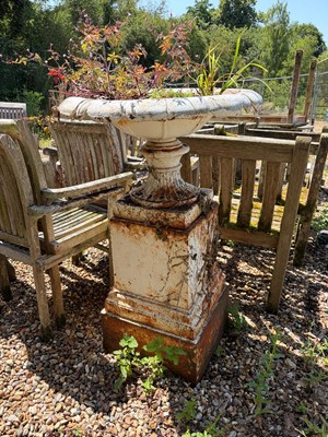 Lot 553 - A large shallow cast iron urn