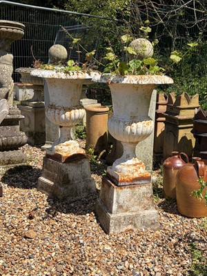 Lot 559 - A pair of white painted campana urns