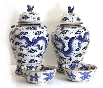 Lot 56 - A pair of large blue and white porcelain jars and covers