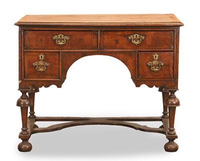 Lot 546 - A George I / George II walnut and cross banded writing table
