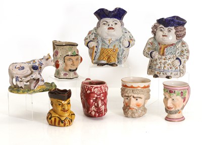 Lot 321 - Five pottery and bone china 'Mask' jugs