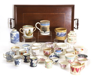Lot 130 - A collection of English tea cups, coffee cans and christening mugs