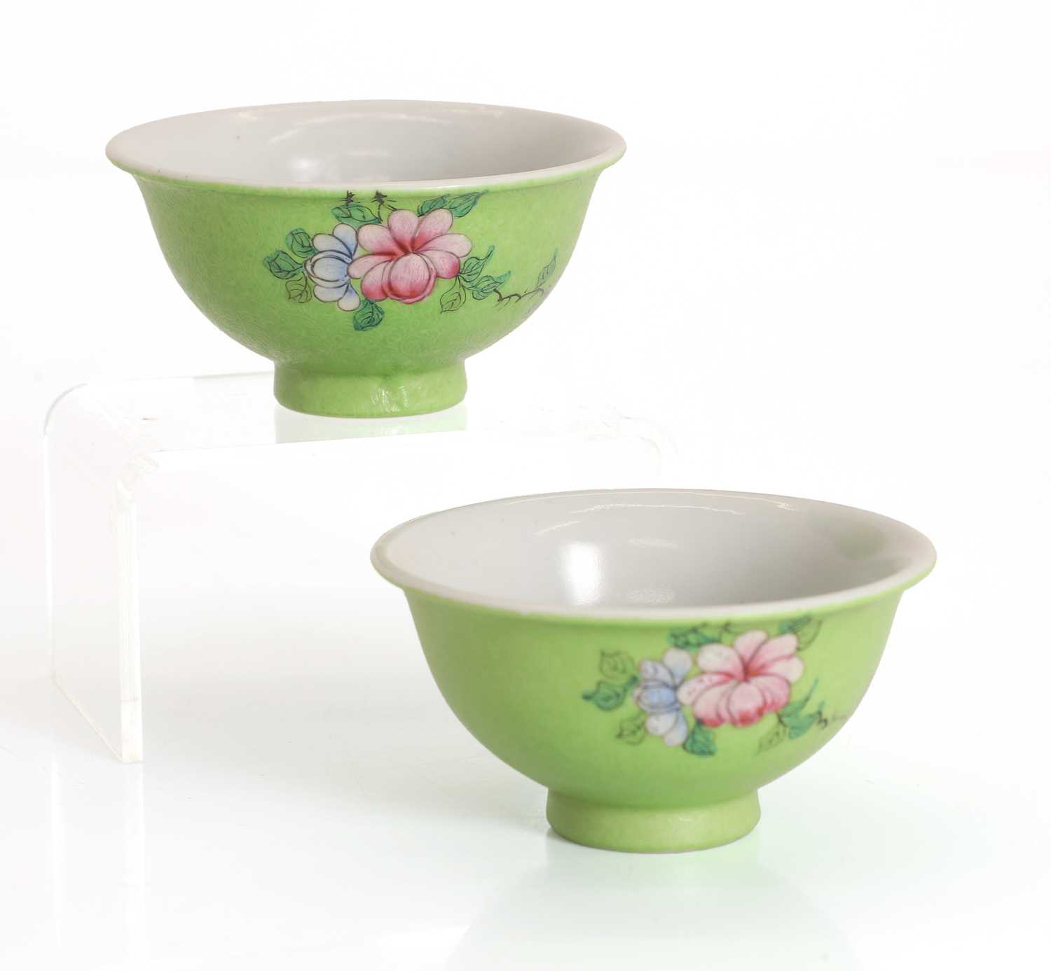 Lot 56 - A pair of Chinese sgraffito green-ground famille rose tea bowls