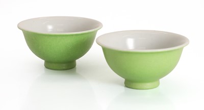 Lot 56 - A pair of Chinese sgraffito green-ground famille rose tea bowls