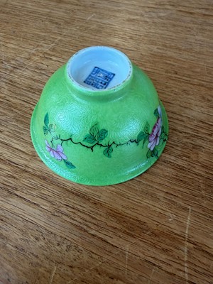 Lot 56 - A pair of Chinese sgraffito green-ground famille rose tea bowls