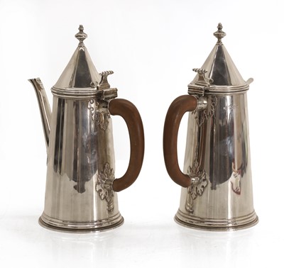 Lot 11 - A pair of silver cut card coffee and hot water pots