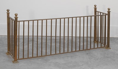 Lot 548 - A low brass fire fender