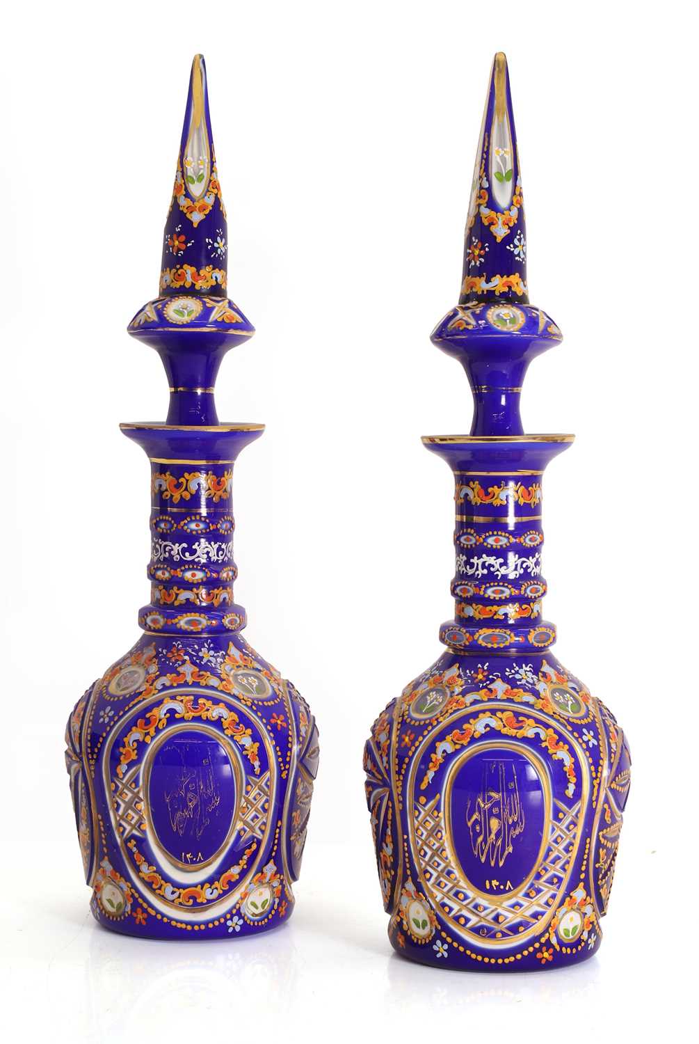 Lot 155 - A pair of Bohemian, for the Ottoman market, blue glass decanters