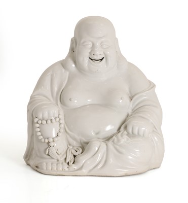 Lot 52 - A Chinese blanc de chine porcelain figure of a Budai