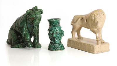 Lot 109 - A glazed model of a lion