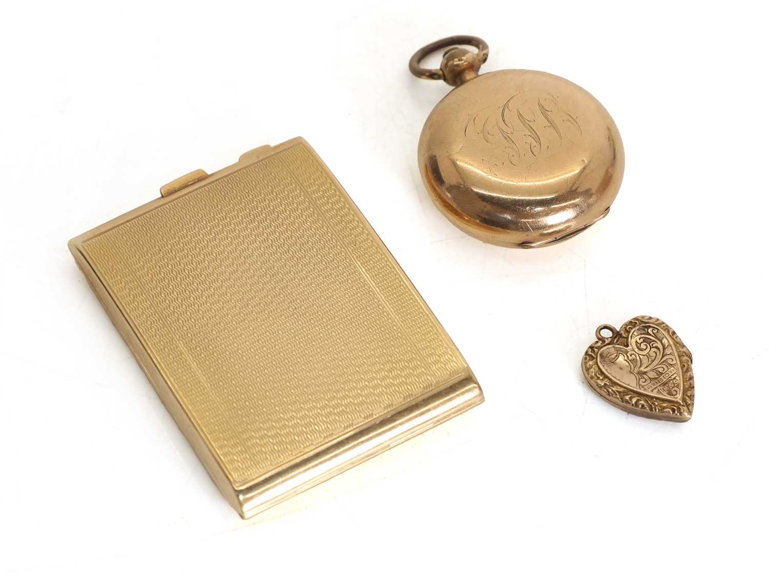 Lot 18 - A 9ct gold vesta case, a 9k heart pendant and rolled gold sovereign case