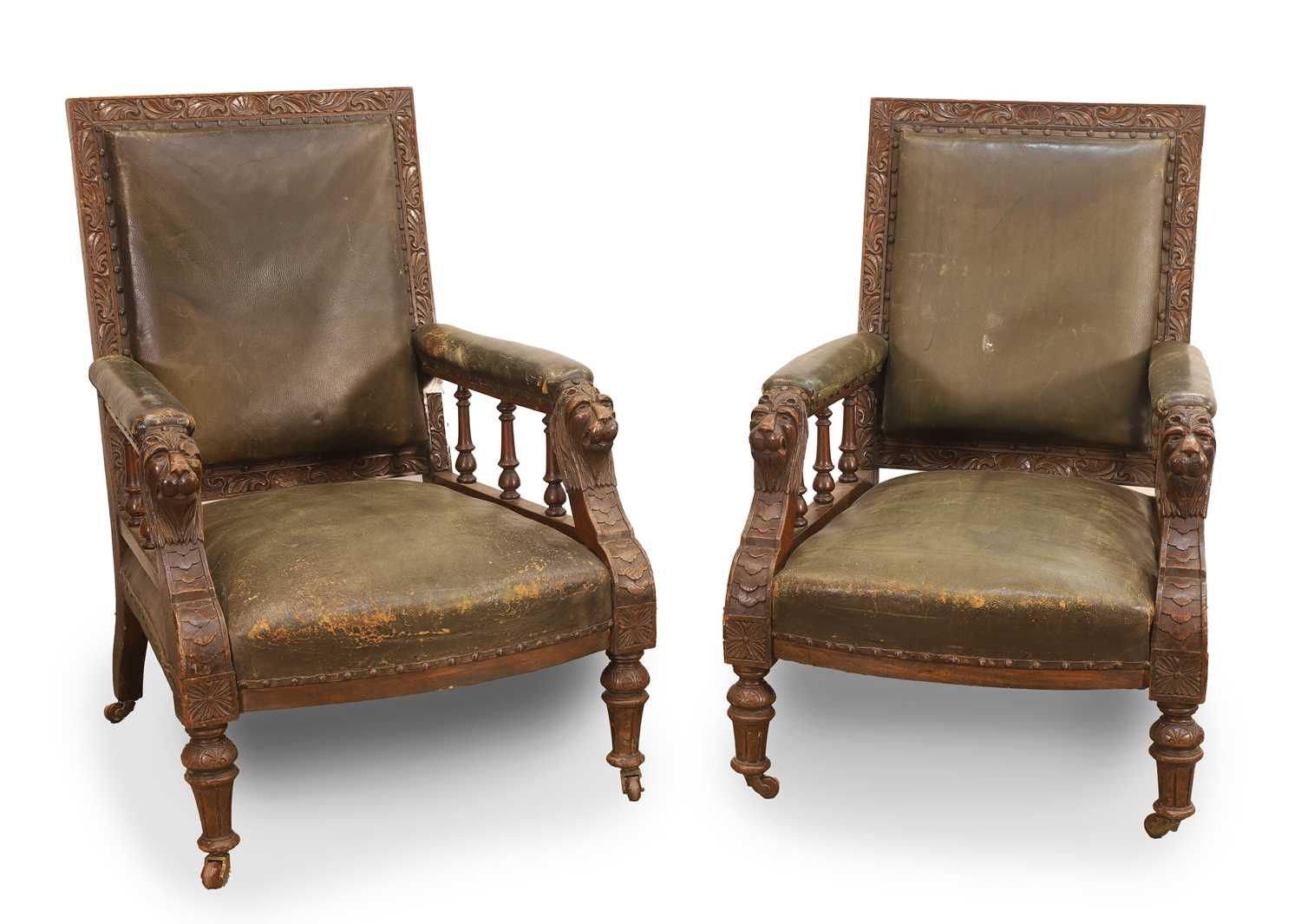 Lot 501 - A pair of Victorian carved oak and leather armchairs