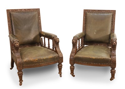 Lot 514 - A pair of Victorian carved oak and leather armchairs