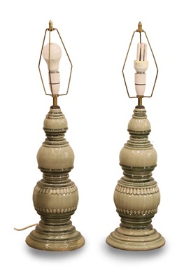 Lot 477 - A pair of small Asian style green glazed lamps