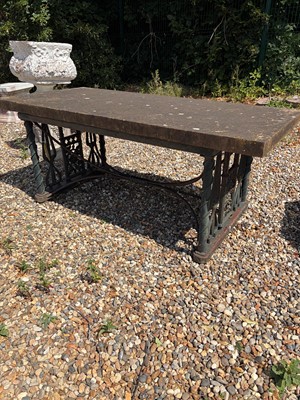 Lot 551 - A cast iron garden table