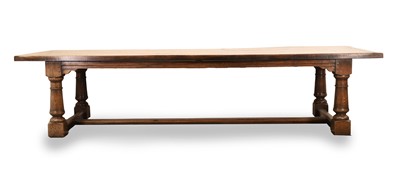 Lot 502 - A large three plank oak dining table