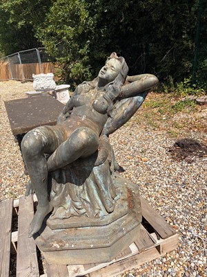 Lot 553 - A bronze reclining nude female figure