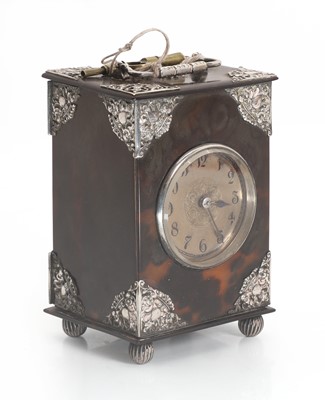 Lot 203 - A small tortoiseshell and silver mounted carriage clock
