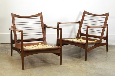 Lot 522 - A pair of teak armchairs