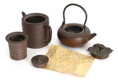 Lot 60 - A Chinese Yixing zisha three piece teapot