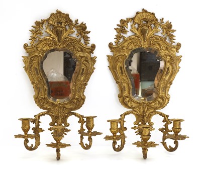 Lot 334 - A French Rococo revival pair of gilded bronze wall mirrors
