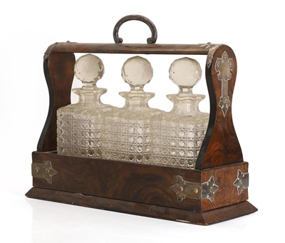Lot 303 - A Victorian walnut cased tantalus