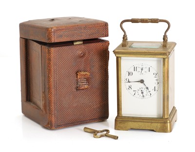 Lot 205 - A small brass carriage clock