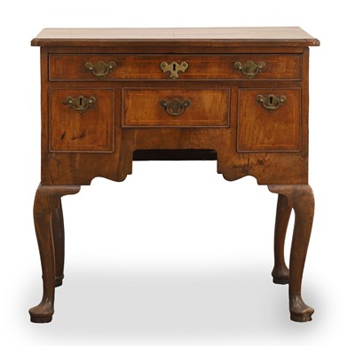 Lot 512 - A walnut lowboy