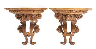 Lot 532 - A pair of walnut wall brackets