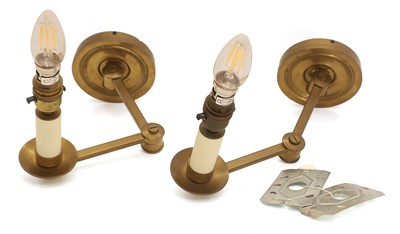 Lot 478 - A pair of brass library wall lights